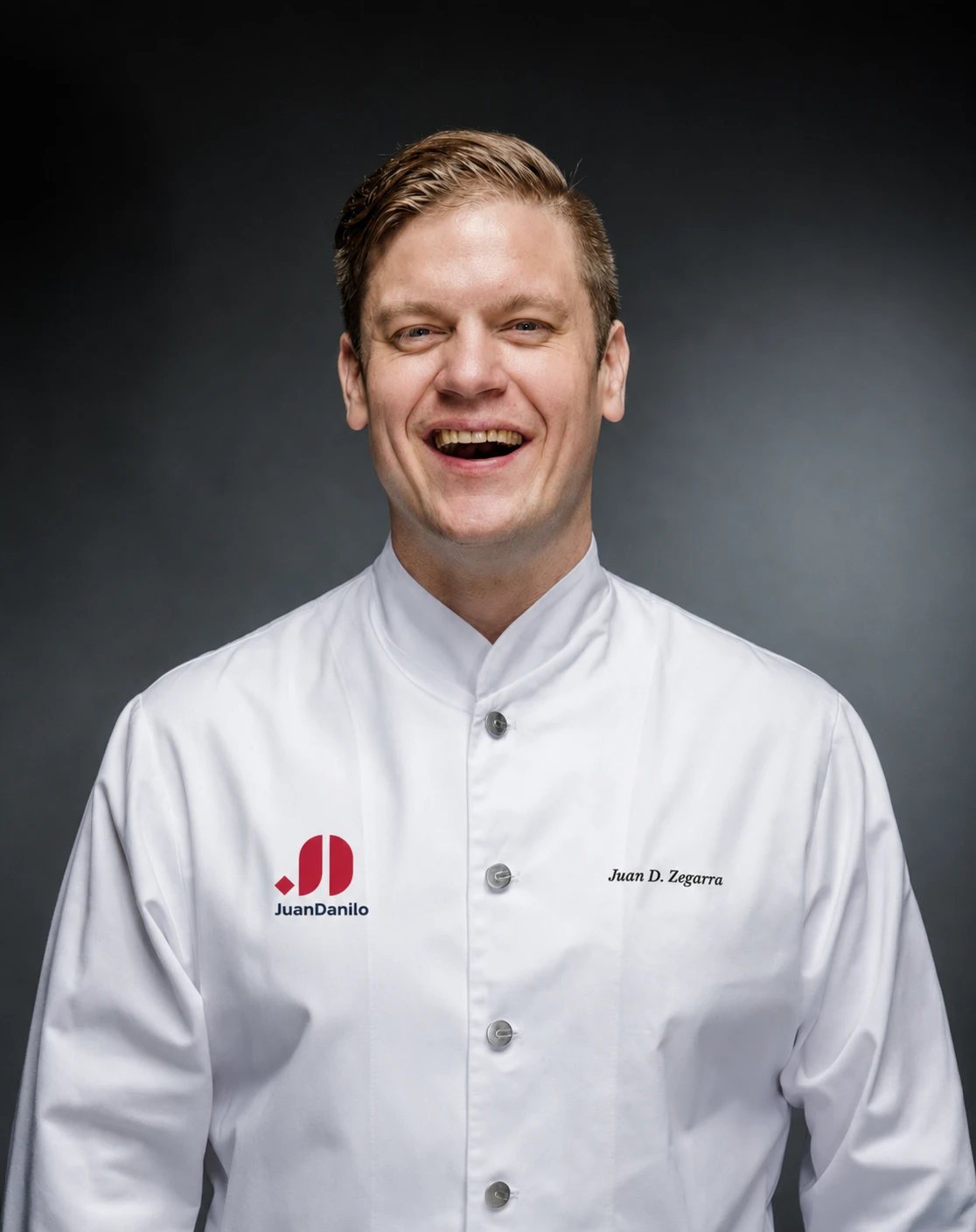 Juan Danilo Zegarra Presser laughing, in chef's whites